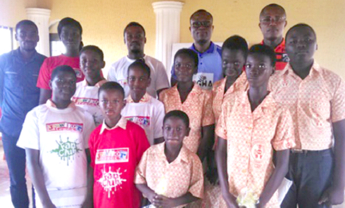A group photograph of the executive members of the club, contestants of the quiz competition, some of the teachers and Headteacher of the School, Mr Edwrad Nti (first right).